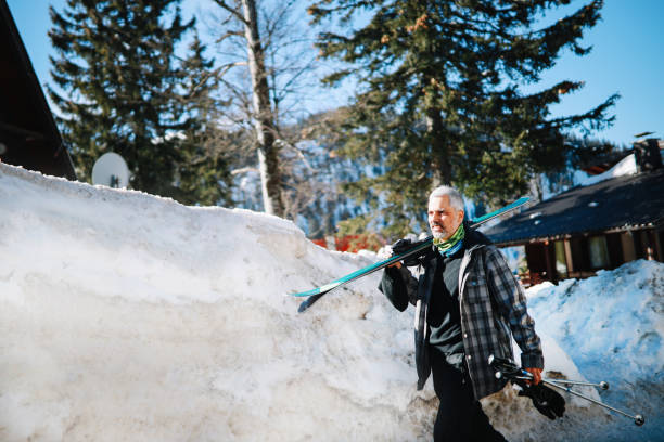 istock Active older man skiing on the mountain top 1304611940