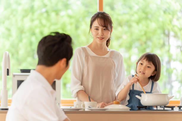 istock young japanese family cooking in kitchen 1304611948