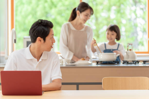 istock young japanese family relaxing in kitchen 1304611952