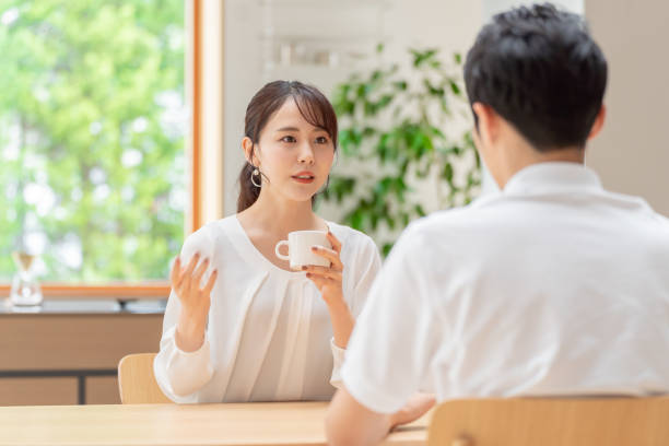istock young japanese couple drinking tea in kitchen 1304611954