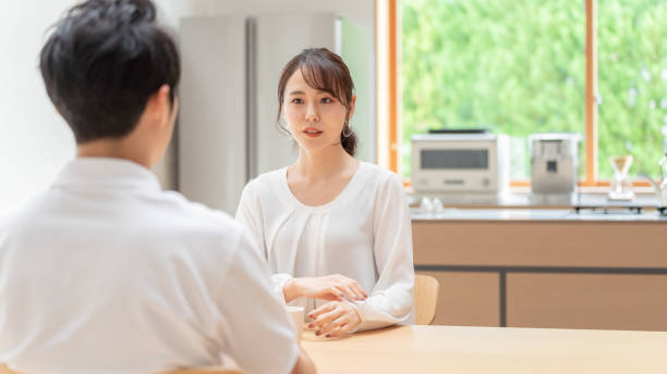 istock young japanese couple drinking tea in kitchen 1304611962