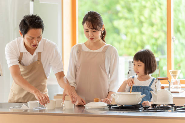 istock young japanese family cooking in kitchen 1304611967
