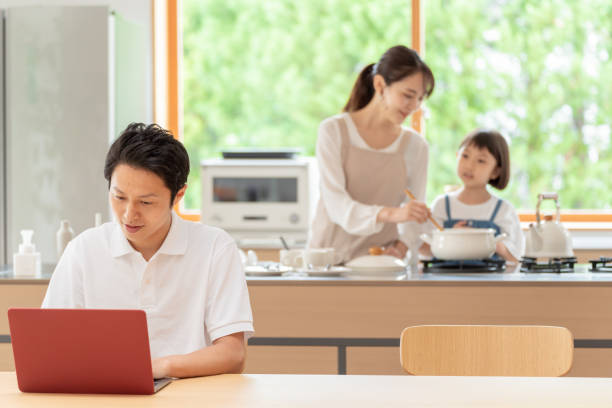 istock young japanese family relaxing in kitchen 1304611984