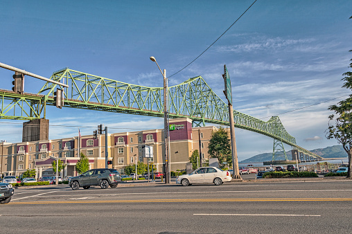 Astoria, Oregon - USA: This Bridge in Oregon crosses the Columbia River to the state of Washington with a large Motel below on this June day it had a great view of the bridge crossing to Washington and the sights of this community on the edge of the Columbia River