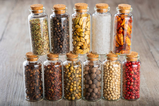 istock Glass jars with different types of spices and pepper 1304613022