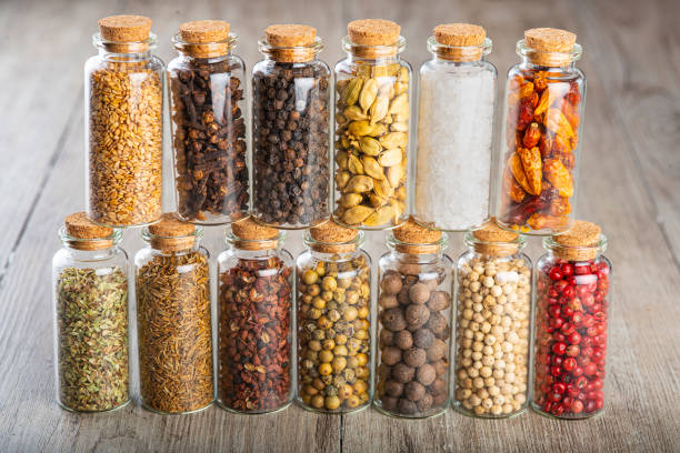 istock Glass jars with different types of spices and pepper 1304613057