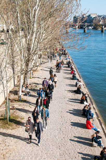 Paris : Quai de Seine crowded during pandemic Covid-19. February 28, 2021