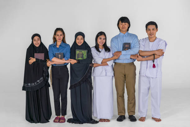 portrait of multicultural group of diverse religious asian people Christian Buddhist and muslim posing together showing inclusive teamwork and cooperation portrait of multicultural group of diverse religious asian people Christian Buddhist and muslim posing together showing inclusive teamwork and cooperation religious occupation stock pictures, royalty-free photos & images