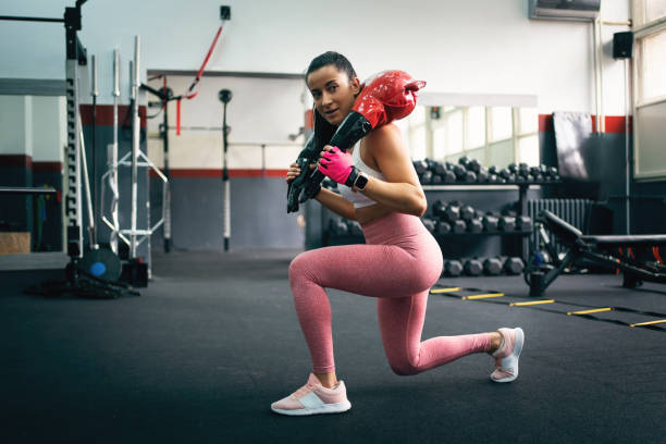 istock Young fit woman doing lunges exercise with bulgarian training bag 1304619017