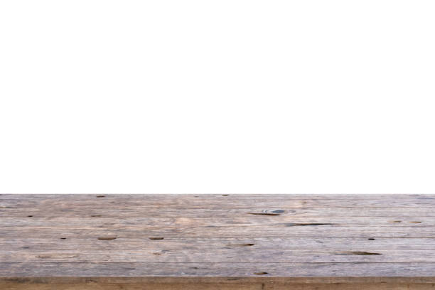 istock Empty wooden table top isolated on white background for montage product display 1304619906