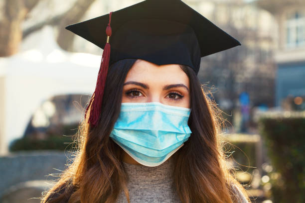 istock Graduate girl wearing a protective face mask 1304620802