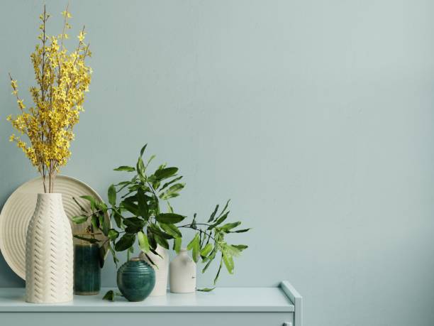 istock Interior wall mockup with green plant,Light blue wall and shelf. 1304620827