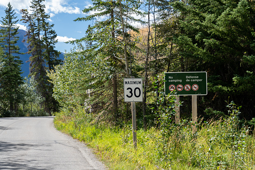 Maximum 30 km speed limit sign at Vermilion Lakes road in summer season sunny day. Banff Legacy Trail, Banff National Park, Canadian Rockies, Alberta, Canada.
