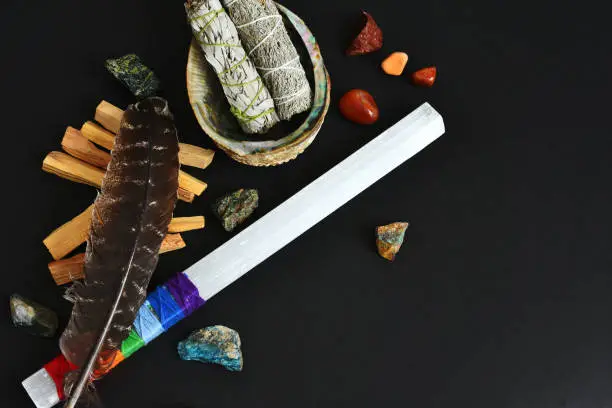 A top view image of a spiritual healing smudge kit bundle on a black background.
