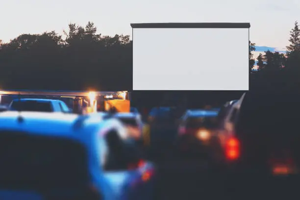 Movie goers enjoy a socially distanced drive in movie.