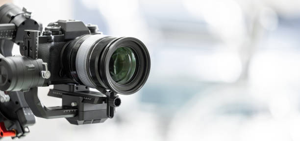 istock Gimbal video camera, Videographer using dslr camera anti shake tool for stabilizer record video. 1304629147