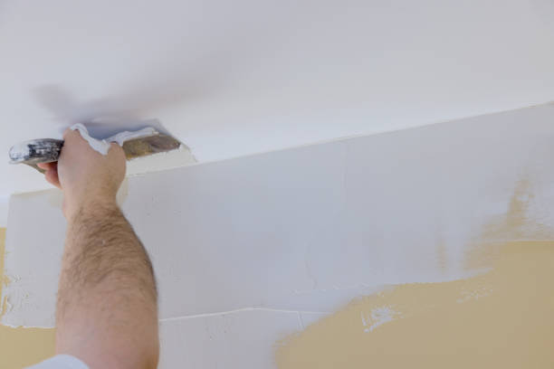 istock Home interior renovation on plastering wall coating putty plaster on the wall 1304634707