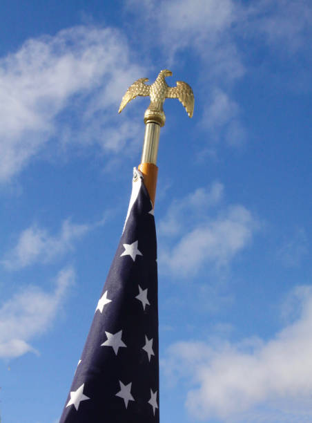 istock Eagle On Top Of American Flag Pole 1304636229