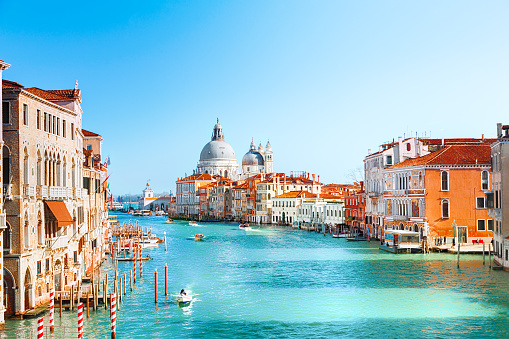 Docked gondolas along the Grand Canal in Venice