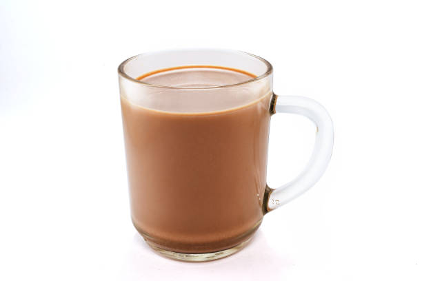 istock Glass of chocolate milk isolated white background 1304640430