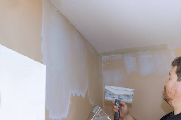istock Plastering wall coating putty plaster on the wall 1304647453