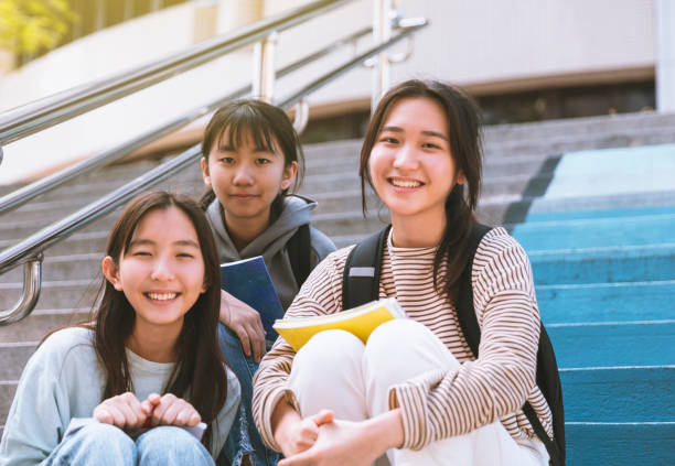 istock Happy Teenager Students talking  On Stairs 1304649794