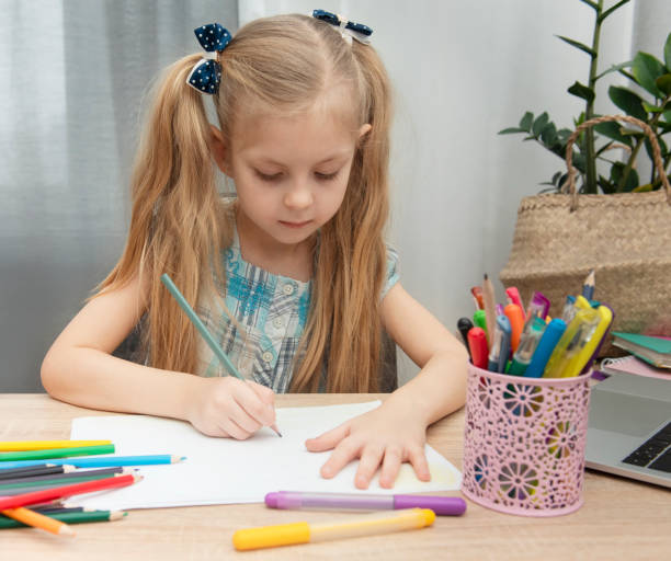 istock Cute girl doing homework 1304652312