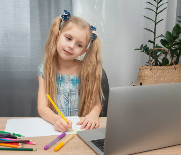 istock Cute girl doing homework 1304652356