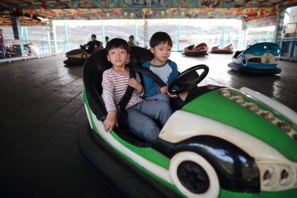 istock Children on Funfair Dodgems 1304654120