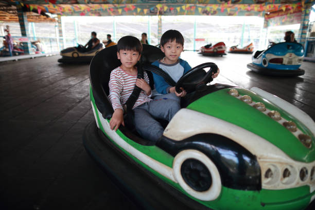 istock Children on Funfair Dodgems 1304654122