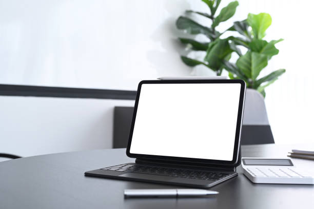 istock Accountant workspace with computer tablet and calculator on black office desk. 1304654274