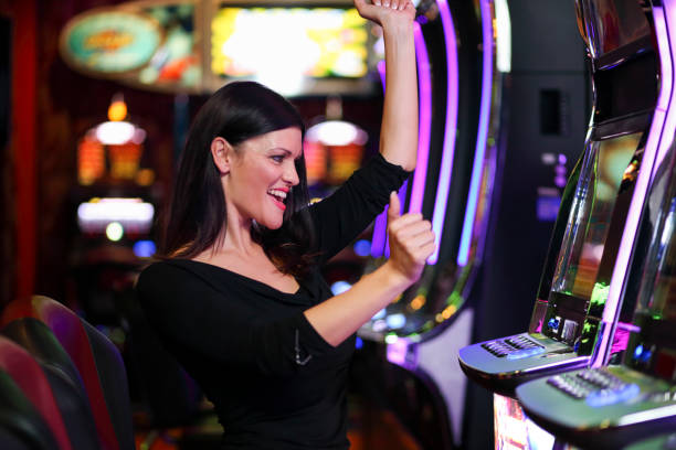 istock Woman on slot machines 1304656177
