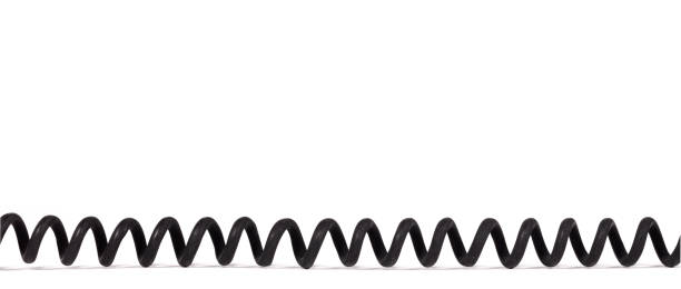 istock Old dirty black telephone cord (vintage), isolated 1304656958