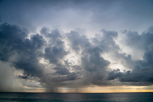 Dramatic sky with massive rain clouds on the scenic sunset in Hikkaduwa, Sri Lanka, in the winter season.