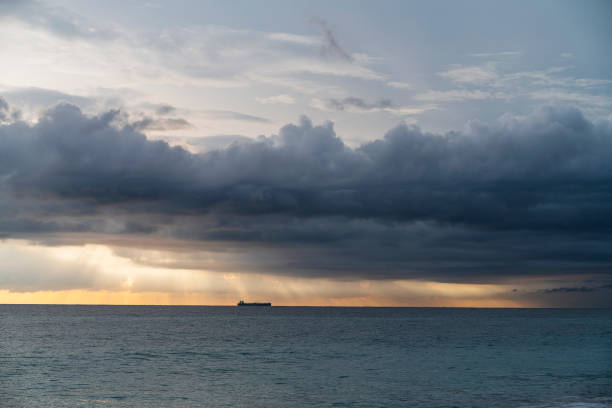 Dramatic sky with massive rain clouds on the scenic sunset in Hikkaduwa, Sri Lanka, in the winter season.