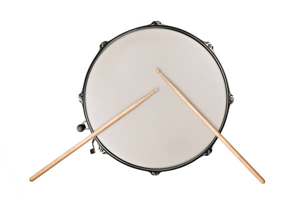 top view of a snaredrum and two drumsticks on white background top view of a snaredrum and two drumsticks on white background snare drum photos stock pictures, royalty-free photos & images