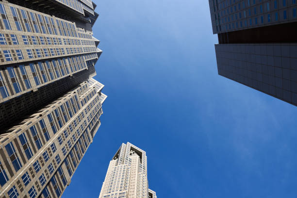 istock Low angle view of skyscrapers against blue sky 1304658211