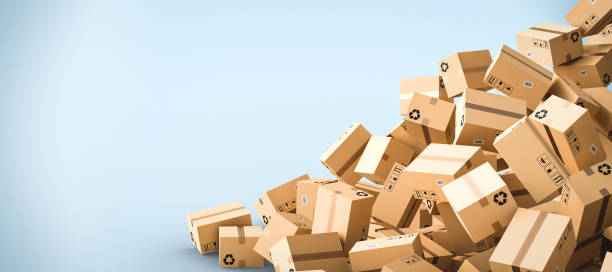 istock Cardboard boxes on blue background with empty copy space on left side, logistics and delivery concept 1304659477