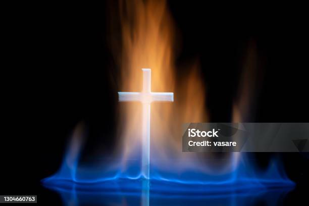 Cross Or Crucifix Surrounded By Burning Fire Flames Stock Photo - Download Image Now