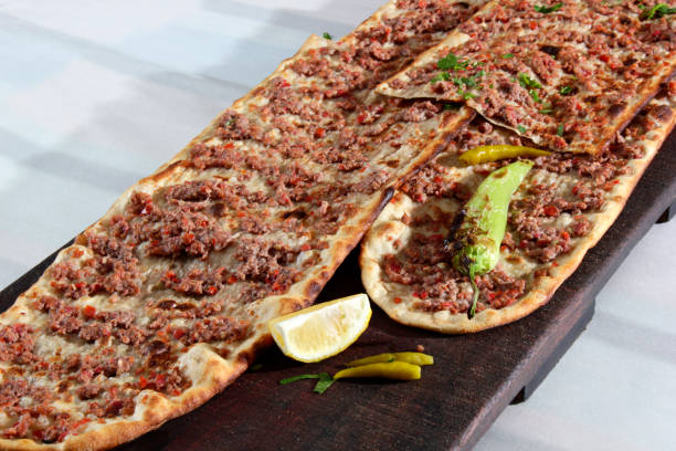 Turkish traditional minced meat pide. Turkish pizza, Etliekmek. stock photo