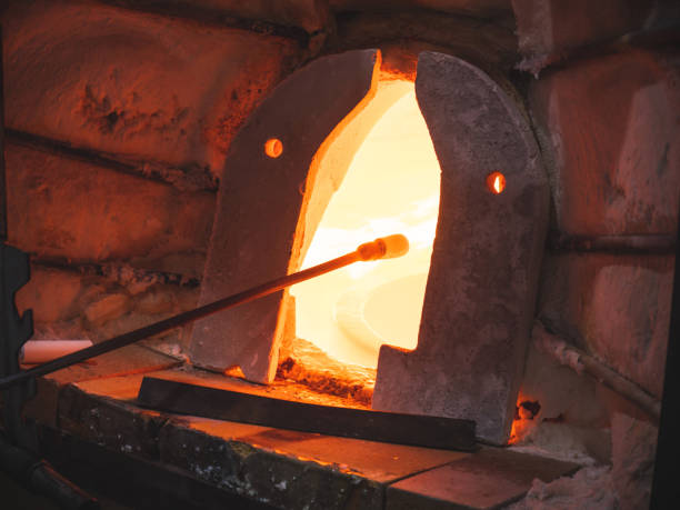 istock Glass blowing furnace and traditional tools at a glass makers workshop 1304665964