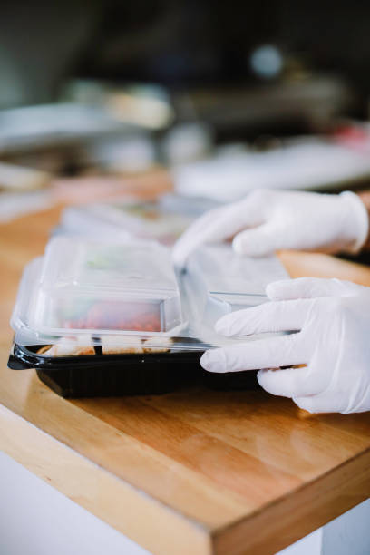 istock person packing lunch box 1304669418