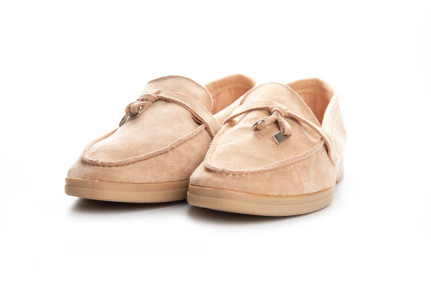 istock brown suede loafers shoes. Studio shot, white background 1304671273