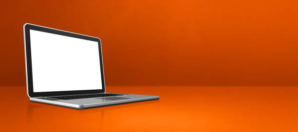 istock Laptop computer on orange office scene background banner 1304672206
