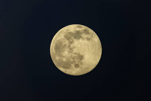 istock Full moon in the dark winter night with clearly visible moon surface during a weak partial eclipse 1304672444