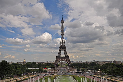 view to Eiffel Tower in Paris, France under blue sky