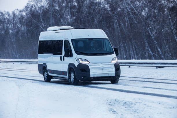 istock minibus moves in winter on a snow-covered road 1304673159