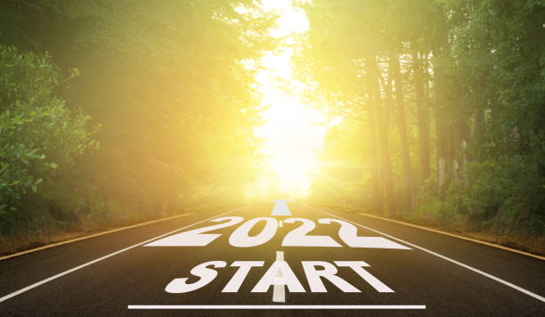 istock The year 2020 is written on the empty road. 1304673642