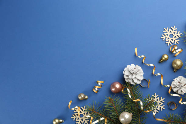 istock Flat lay composition with serpentine streamers and Christmas decor on blue background. Space for text 1304675852