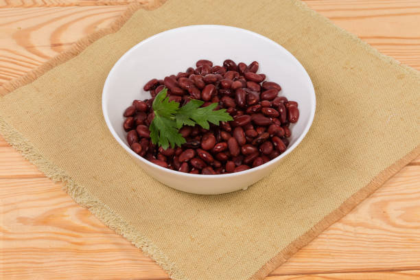 istock Boiled red kidney beans in white bowl on a placemat 1304676047
